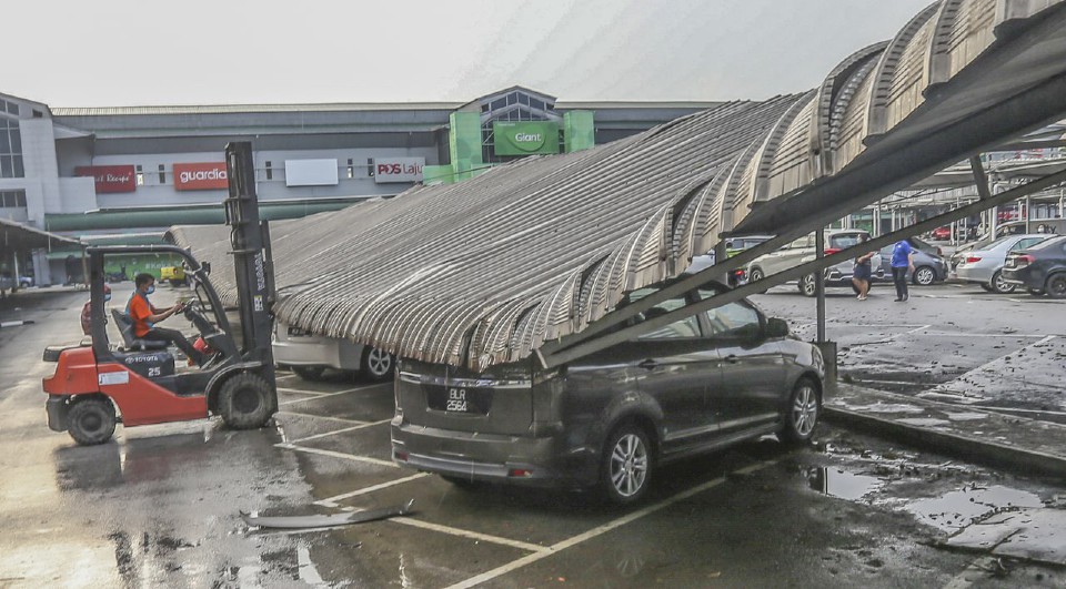 Aftermath of a storm damaging a business's parking lot