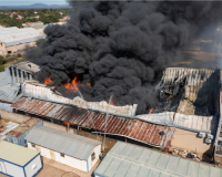 Building on fire, illustrating the importance of avoiding business insurance mistakes in Malaysia.