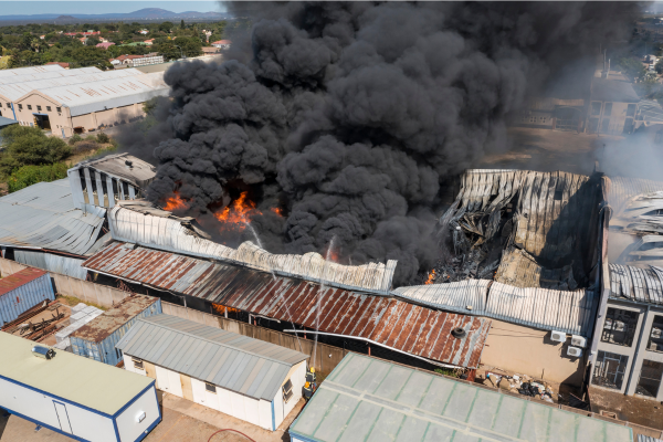 Building on fire, illustrating the importance of avoiding business insurance mistakes in Malaysia.